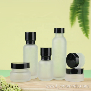 Wholesale Cosmetic Frosted glass bottle with black caps, frosted glass bottles/jars